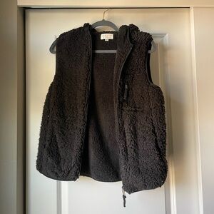 Weatherproof Vintage Black Fuzzy Vest with pockets.